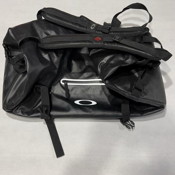 Oakley Motion 42L Factory Pilot Bag Blackout Roll Top Carry Case Backpack - Picture 1 of 8
